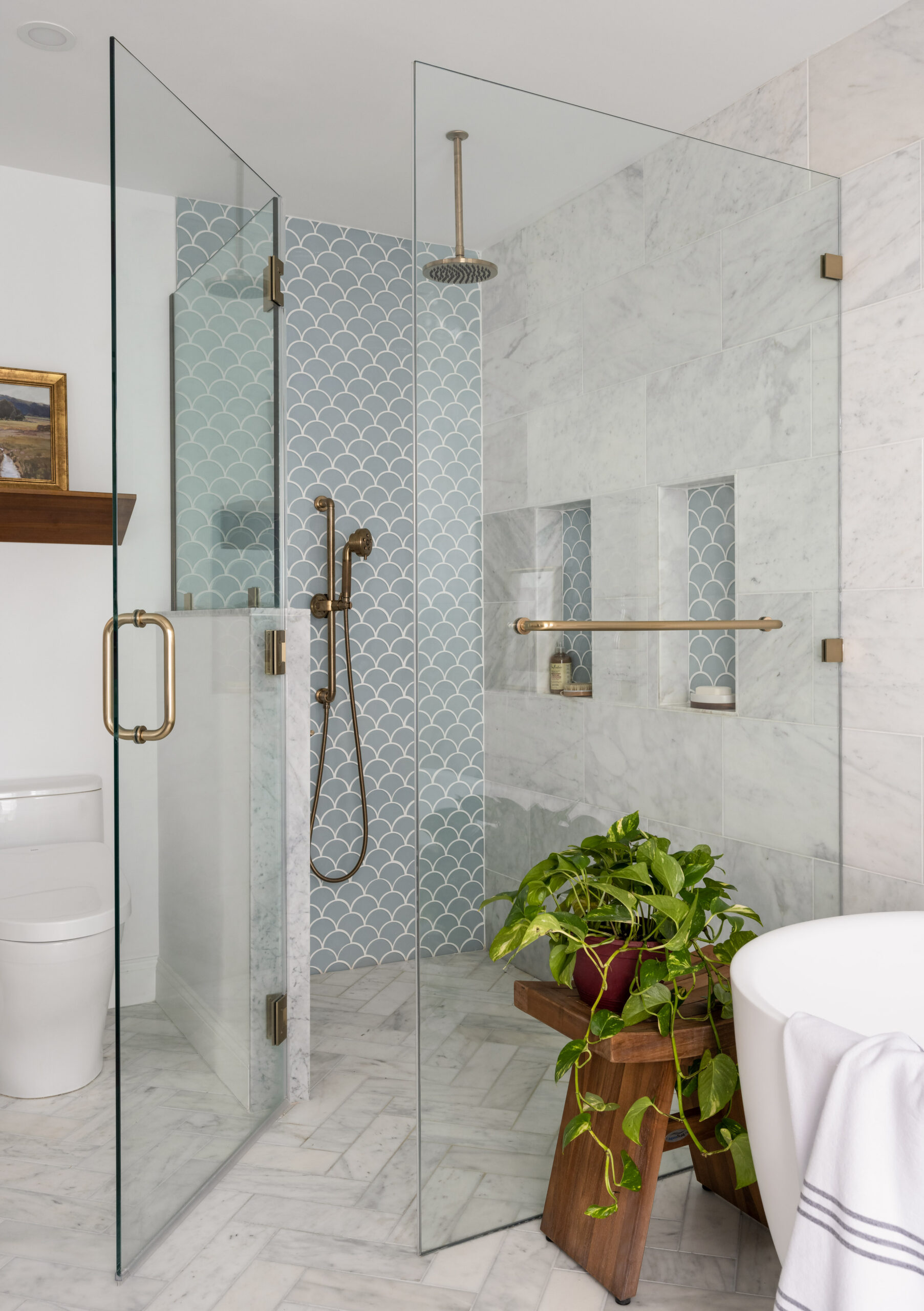 Needham Luxury master bathroom retreat with curbless shower and shower niches and light blue scallop tile